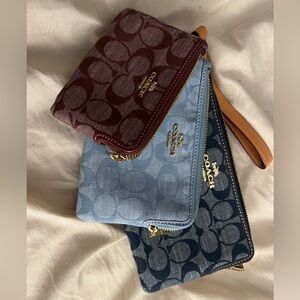 Brand new - never used 3 coach wristlets